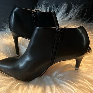 BCBGeneration Booties Black with Gold Chain rim New With Tag , Never worn.